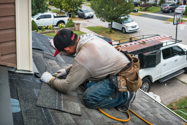 Professional Roofing technician working in Utica, IN